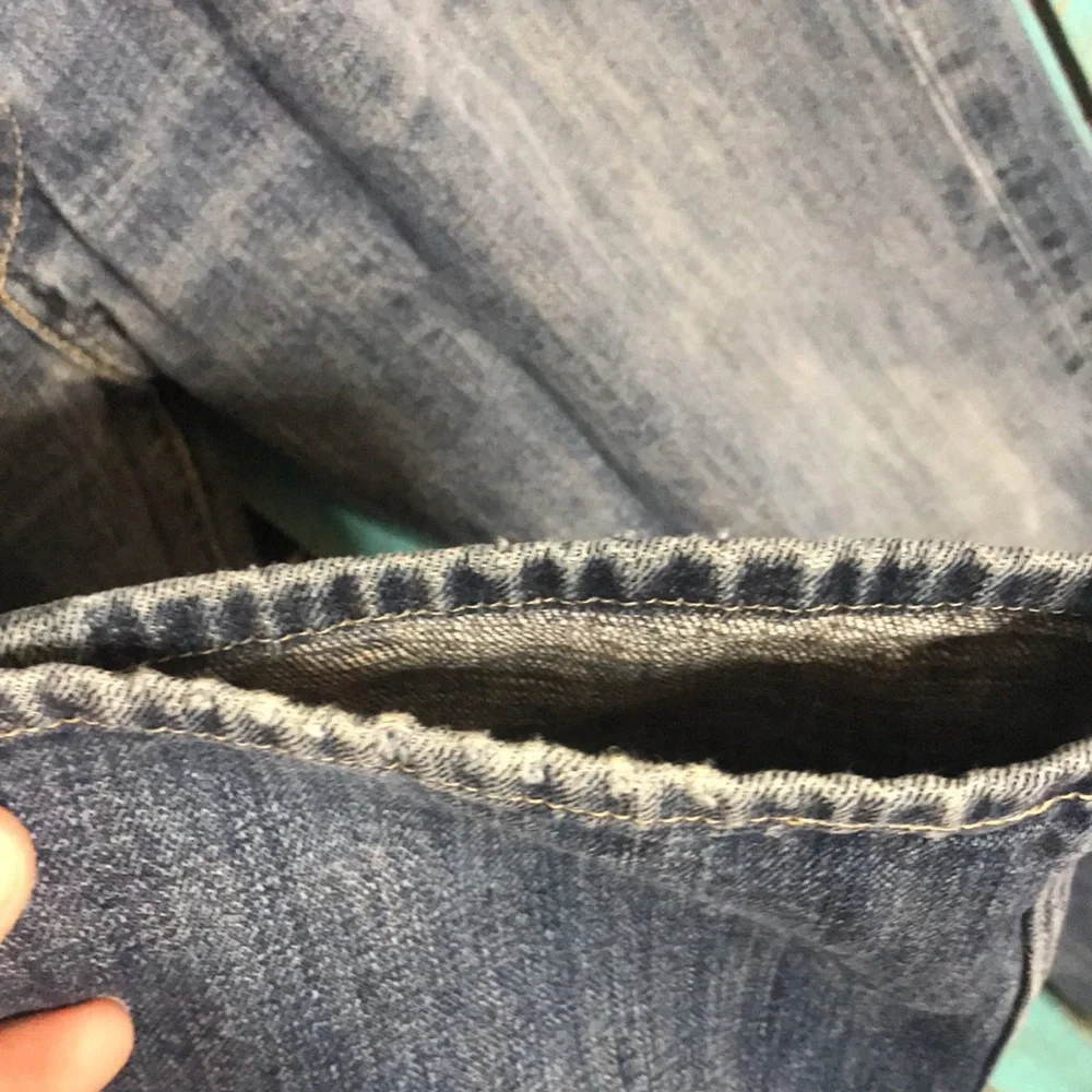 Levi’s 501 button fly Jeans size 35x28 (tag size 36x34) lightly distressed